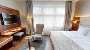 Postel nebo postele na pokoji v ubytování Hotel Oranien Wiesbaden