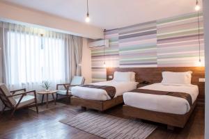 Letto o letti in una camera di Potala Guest House