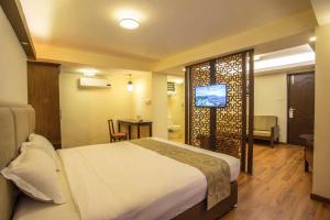 Letto o letti in una camera di Potala Guest House