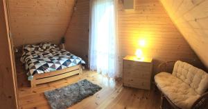 Postel nebo postele na pokoji v ubytování Domek letniskowy Zacisze + 35 fotografií