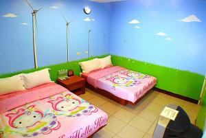 A bed or beds in a room at Hai Zhi Dao Min Su