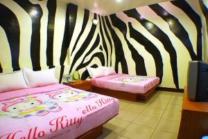 A bed or beds in a room at Hai Zhi Dao Min Su