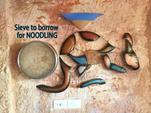 a group of pairs of scissors and a tennis racket at Ali's Underground Studio in Coober Pedy