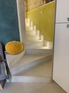 a set of stairs in a room at Bianco Mare in Otranto