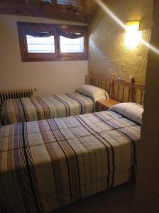 Postel nebo postele na pokoji v ubytování Pensión Rural Arroyo la Teja