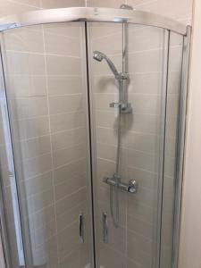 a shower with a glass door in a bathroom at Smeaton serviced Accommodation in Liverpool +82 photos