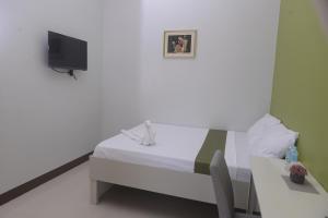 Tempat tidur dalam kamar di Mt Moriah Inn and Resto