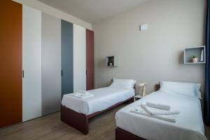 Postel nebo postele na pokoji v ubytování Casa a Colori Padova