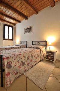 Posteľ alebo postele v izbe v ubytovaní Flat for family & friends in Cagliari’ town center
