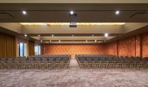 an empty auditorium with empty chairs in a room at Savoy Palace - The Leading Hotels of the World - Savoy Signature in Funchal +37 photos