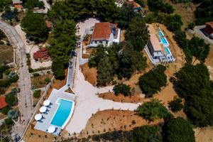 an aerial view of a house with a swimming pool at Ktima Fabiatos in Skala Kefalonias