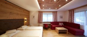 Letto o letti in una camera di Alpenhotel Ernberg