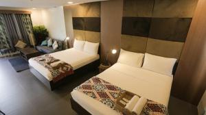 Postel nebo postele na pokoji v ubytování Treetop Suites