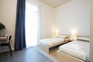 Postel nebo postele na pokoji v ubytování Casa a Colori Padova