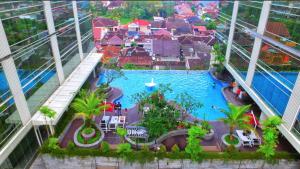 an aerial view of a pool in a building at Lavenderbnb Room 10 at Mataram City Apartment in Yogyakarta