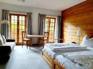 Postel nebo postele na pokoji v ubytování Landgasthof "Wilder Mann"