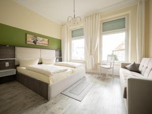 Ένα ή περισσότερα κρεβάτια σε δωμάτιο στο Hotel Boritzka
