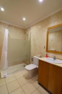 a bathroom with a toilet and a sink and a shower at BeGuest Cascais INN Apartments_ Ocean View in Alcabideche