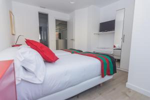 Postel nebo postele na pokoji v ubytování Slow León Apartamentos Turísticos
