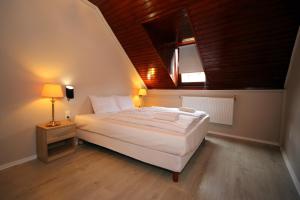 Posteľ alebo postele v izbe v ubytovaní Várkapu Apartman