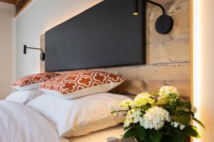 Ein Bett oder Betten in einem Zimmer der Unterkunft Aston‘s Hotel