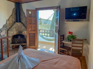 Ένα ή περισσότερα κρεβάτια σε δωμάτιο στο Pousada Arco-Íris +120 φωτογραφίες