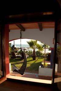 a room with a glass door with a view of a patio at Arte Vida in Tarifa