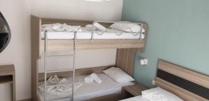 Ένα ή περισσότερα κρεβάτια σε δωμάτιο στο Chriselia 4