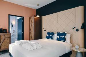 a bedroom with a large bed and a large mirror at Mercure Marseille Canebière Vieux-Port in Marseille