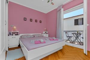 Posteľ alebo postele v izbe v ubytovaní Apartman Lovreta - Ivano