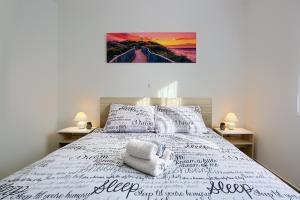 Letto o letti in una camera di LAMALU