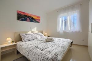 Letto o letti in una camera di LAMALU