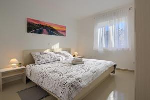 Letto o letti in una camera di LAMALU