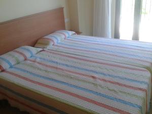 Katil atau katil-katil dalam bilik di Apartamentos Fonda Finet