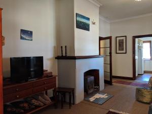 
A television and/or entertainment center at Walnut Cottage - 2 bedroom pet friendly country cottage
