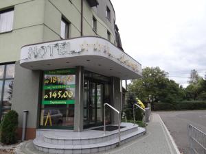 a hotel sign on the front of a building at Hotel Restauracja Kinga in Katowice