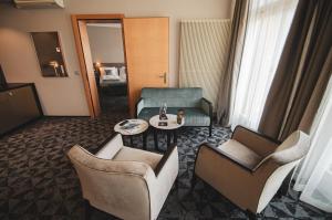 Predel za sedenje v nastanitvi GLANDON Rooms Elite