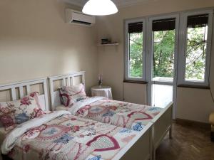 Кровать или кровати в номере ViITOSHKA Apartment