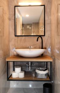 a bathroom with a sink and a mirror at Villa Teuta in Trogir