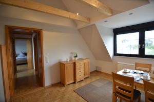 a dining room with a table and a window at Ferienwohnung Bouten A in Geldern