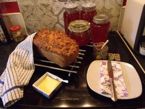 a tray with a loaf of bread and butter on a stove at No 12 B&B in Dungarvan