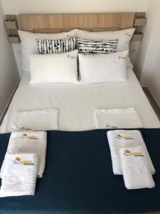 A bed or beds in a room at MAGO APARTMENTS