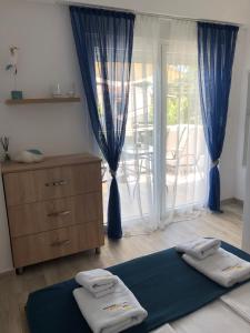 A bed or beds in a room at MAGO APARTMENTS