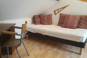 Un pat sau paturi într-o cameră la La buissonnière