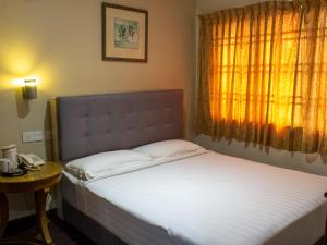 Кровать или кровати в номере Floral Hotel