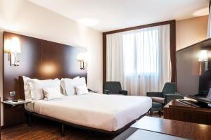Posteľ alebo postele v izbe v ubytovaní Max Hotel Livorno