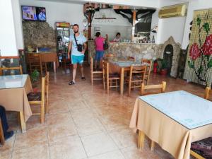 a view of the dining room of a restaurant at Nako Guest House bar&restaurants in Përmet
