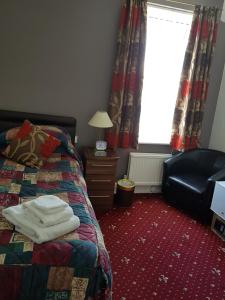 Łóżko lub łóżka w pokoju w obiekcie Karden House