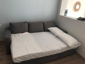 A bed or beds in a room at Lakones Deluxe Suites A