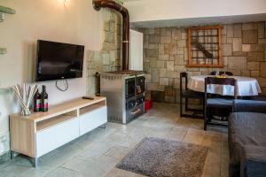 A television and/or entertainment centre at Baita Carnale, Montagna in Valtellina